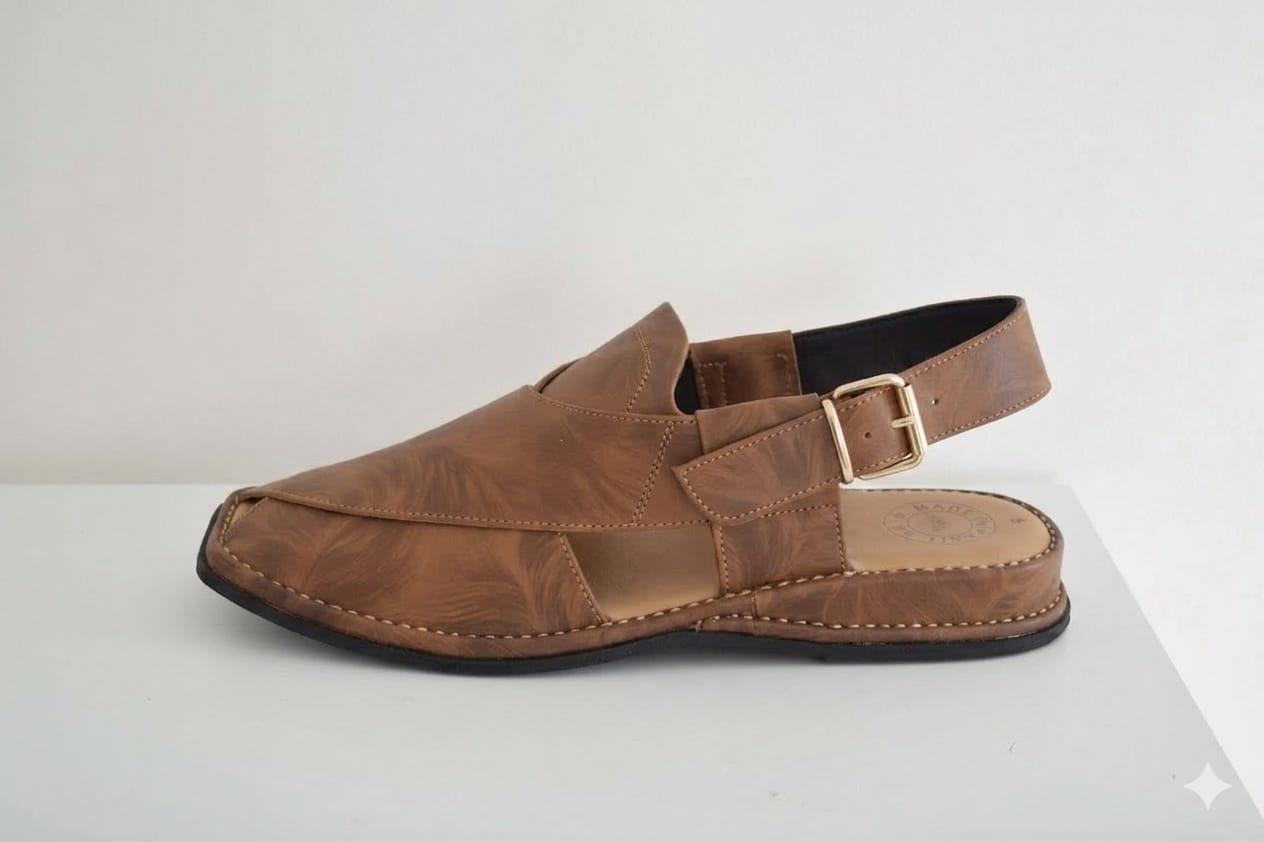 Brown sandal with a strap on a white background